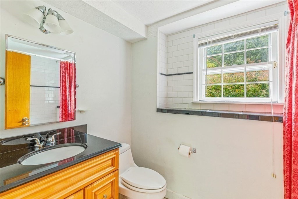 17 Brentwood Road Kingston, MA 02364 - Photo 20 of 33 a bathroom with a granite countertop sink toilet and mirror