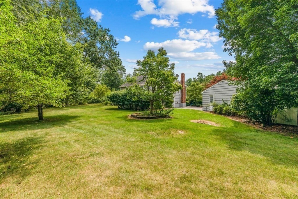 17 Brentwood Road Kingston, MA 02364 - Photo 27 of 33 a backyard of a house with plants and large trees