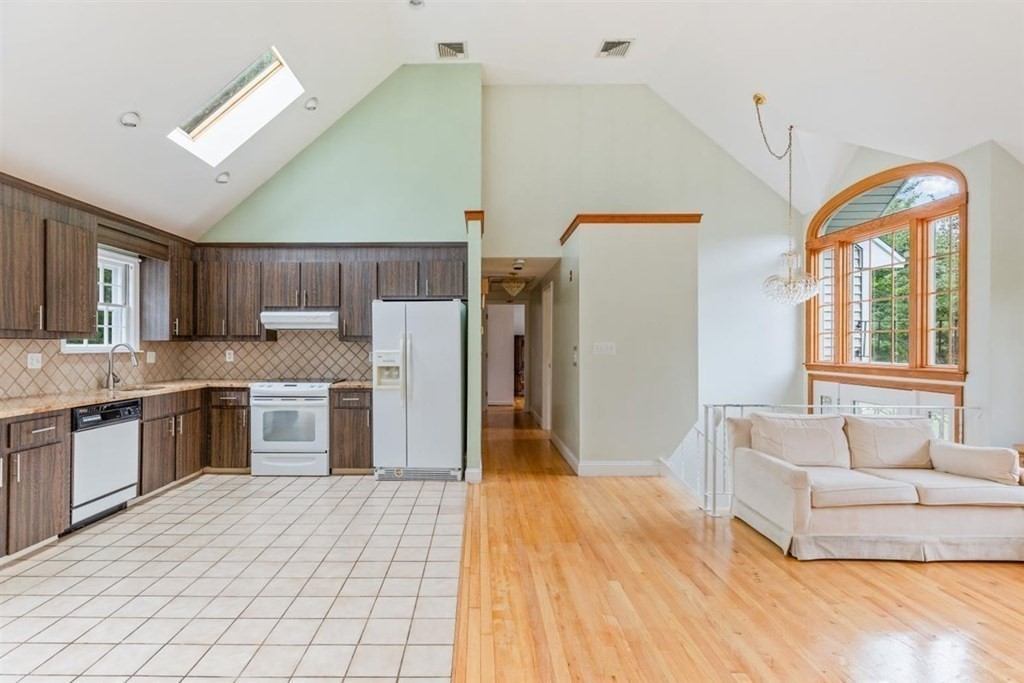 17 Brentwood Road Kingston, MA 02364 - Photo 9 of 33 a living room with stainless steel appliances kitchen island granite countertop furniture and a kitchen view