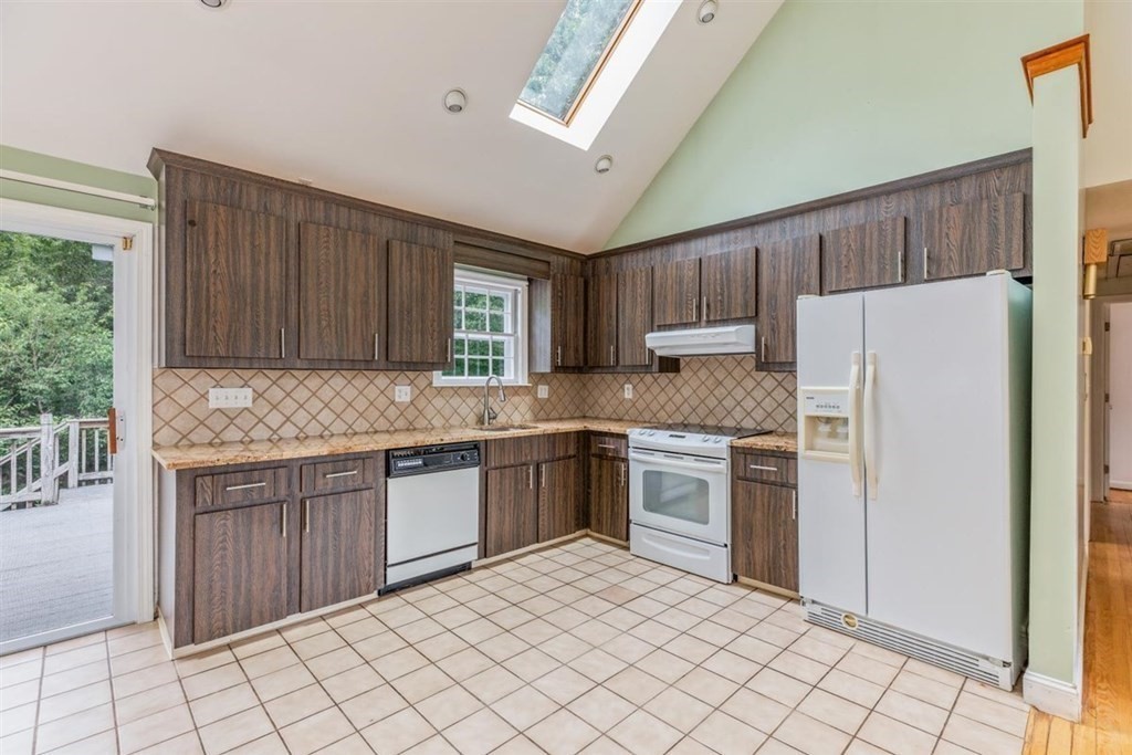 17 Brentwood Road Kingston, MA 02364 - Photo 10 of 33 a kitchen with granite countertop a refrigerator sink and cabinets
