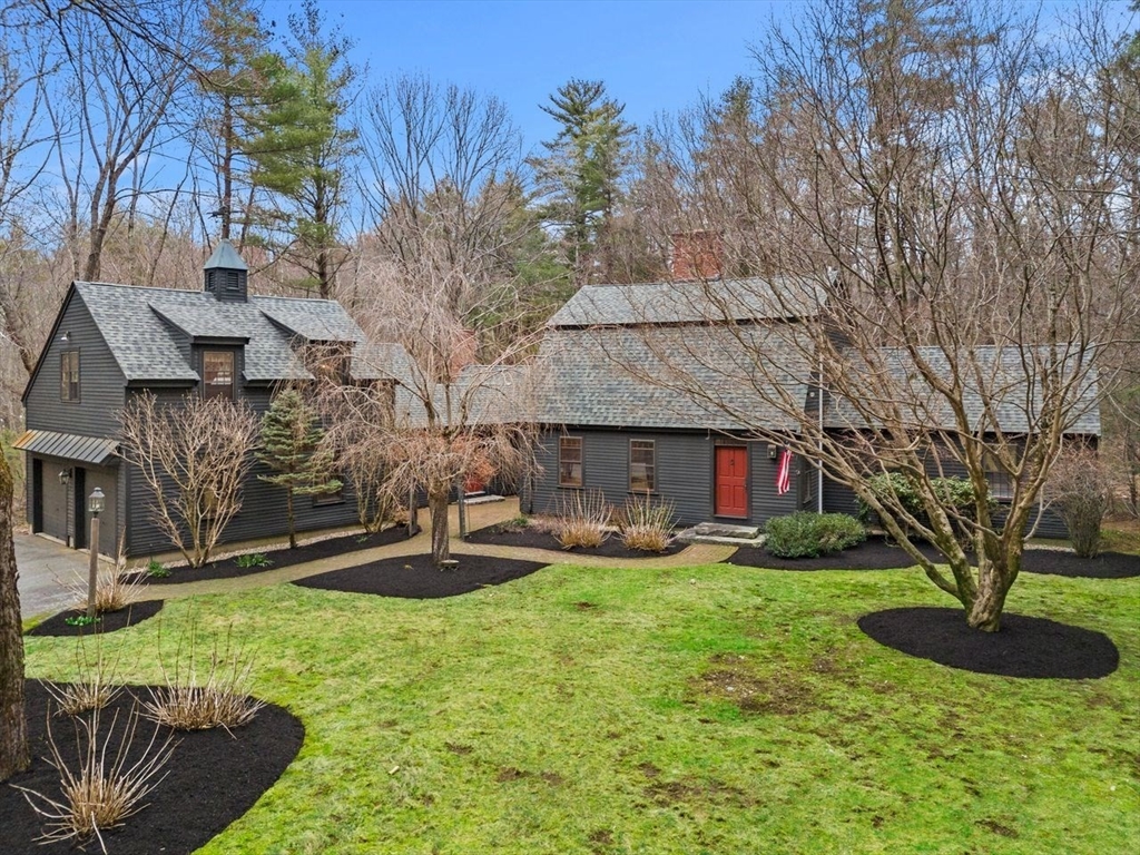 151 Spofford Road Boxford, MA 01921 - Photo 1 of 42 a front view of a house with garden