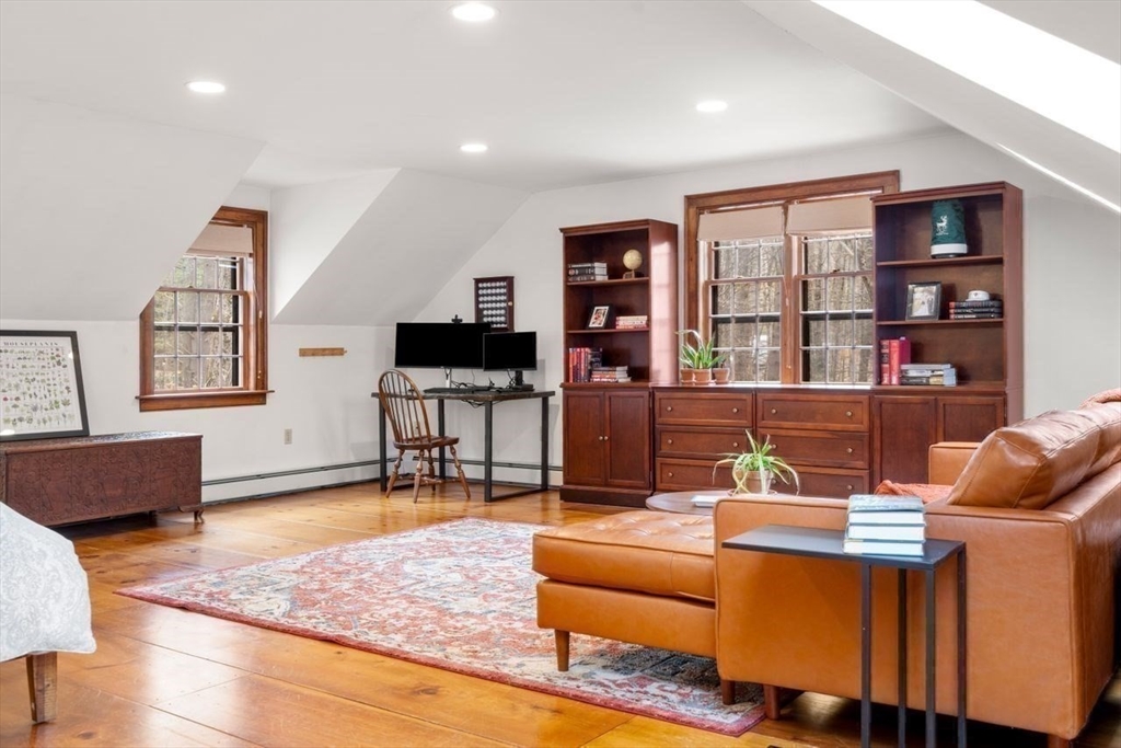 151 Spofford Road Boxford, MA 01921 - Photo 26 of 42 a living room with furniture and a flat screen tv