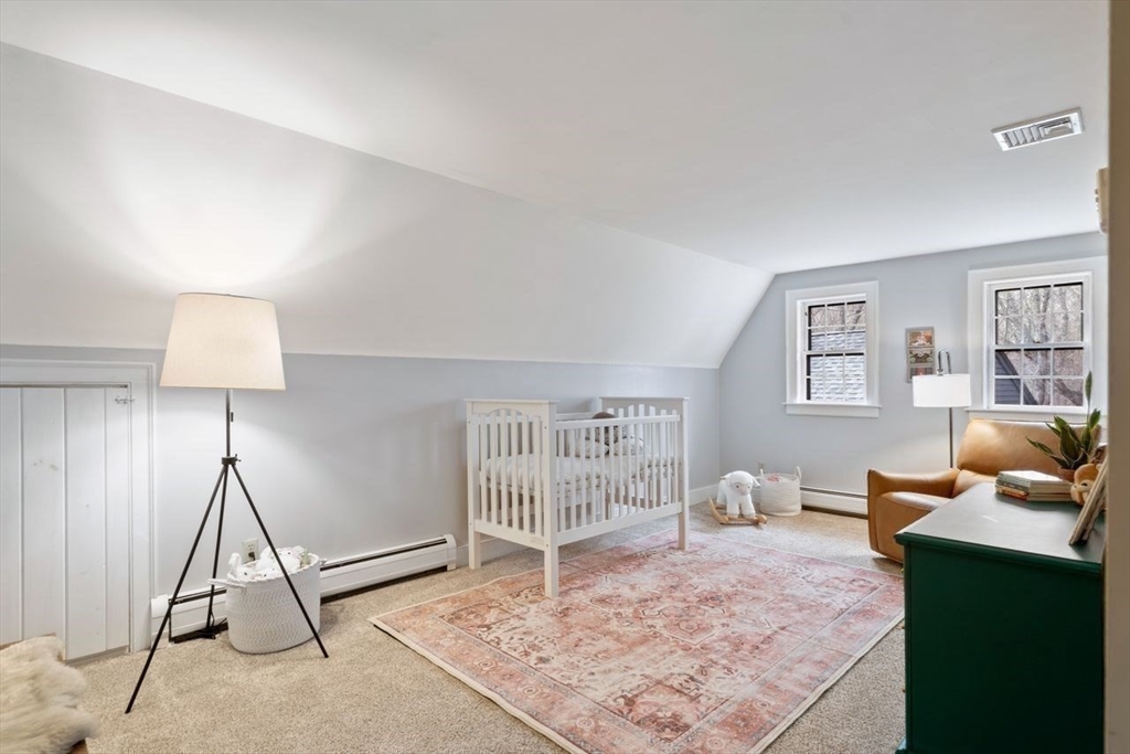 151 Spofford Road Boxford, MA 01921 - Photo 32 of 42 a living room with furniture a rug and a table