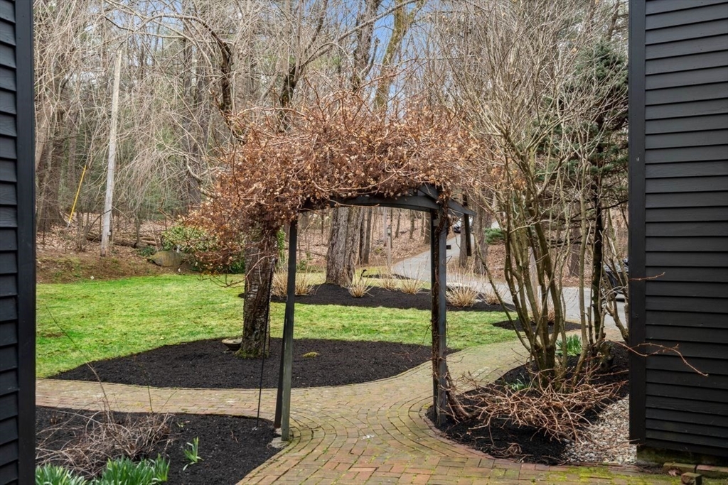 151 Spofford Road Boxford, MA 01921 - Photo 5 of 42 a view of a garden with a tree