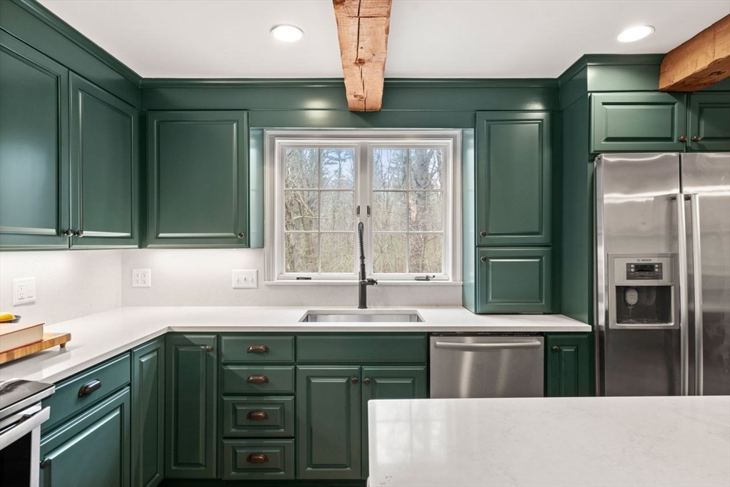 151 Spofford Road Boxford, MA 01921 - Photo 8 of 42 a kitchen with stainless steel appliances a sink and a refrigerator