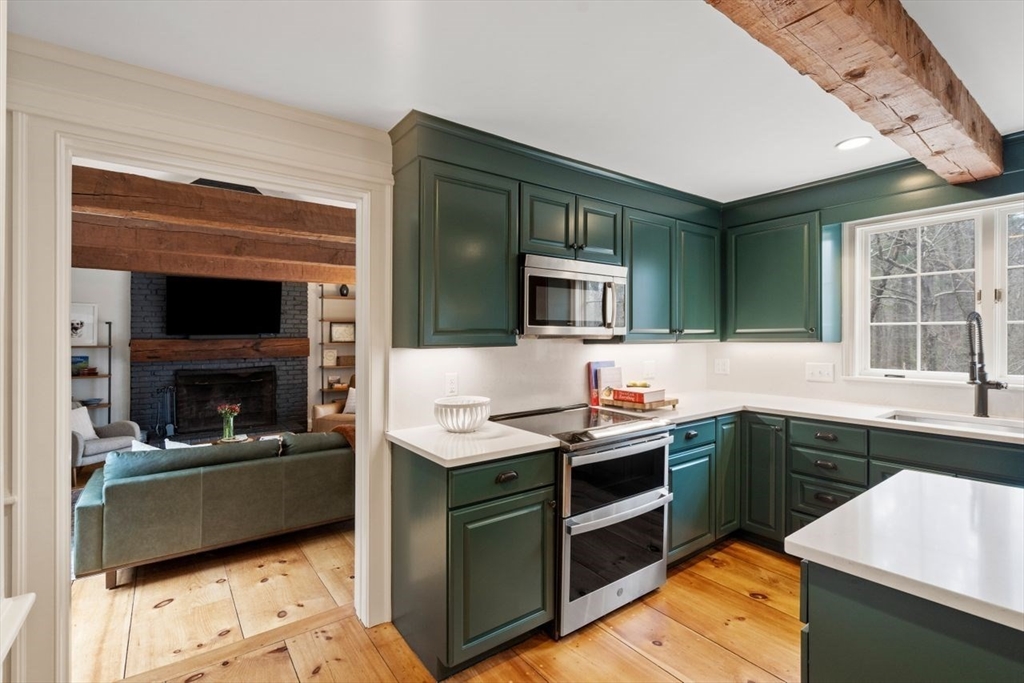 151 Spofford Road Boxford, MA 01921 - Photo 9 of 42 a kitchen with a sink stove and oven