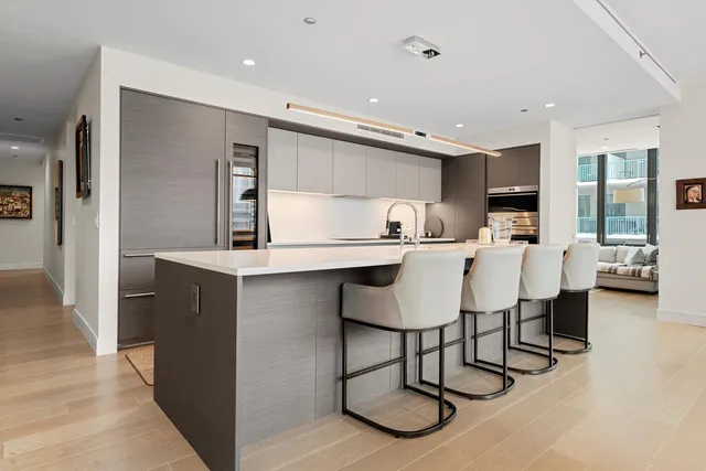 a kitchen with a table and chairs