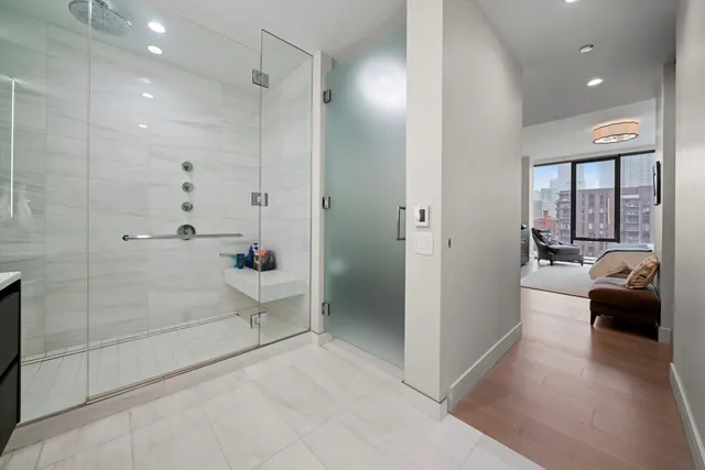a en suite bathroom with a glass door shower