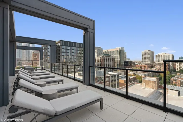 a view of roof deck with patio