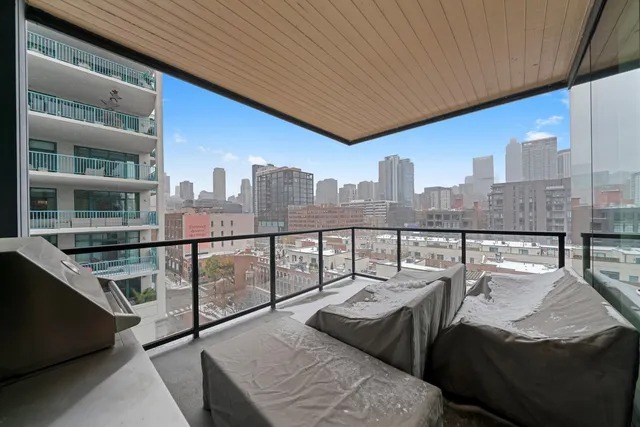 a balcony with furniture and a roof