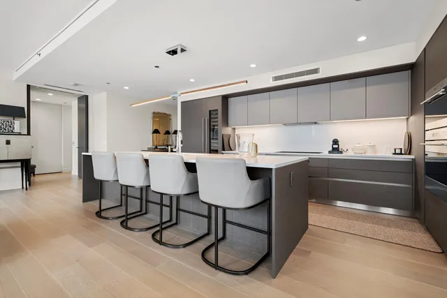 a kitchen with a sink cabinets and window