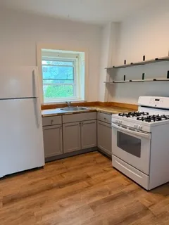 a kitchen with stainless steel appliances granite countertop a stove and a sink