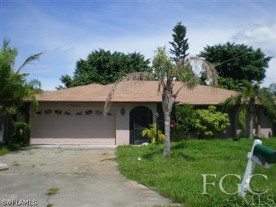 17461 Fuchsia Road Fort Myers, FL 33967 - Photo 1 of 5 a front view of a house with garden