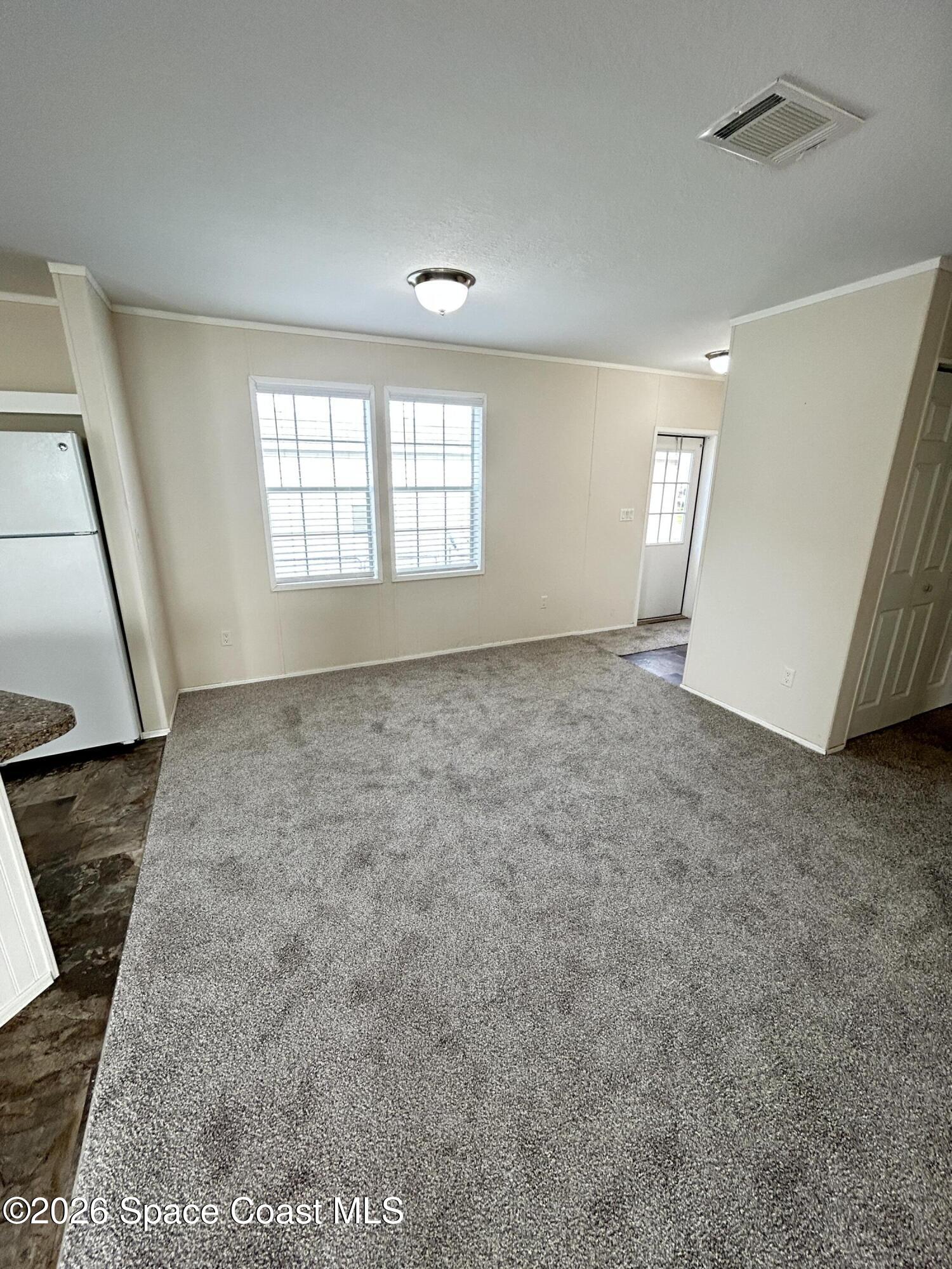 117 Lewis Street Edgewater, FL 32141 - Photo 13 of 26 a view of an empty room and a window