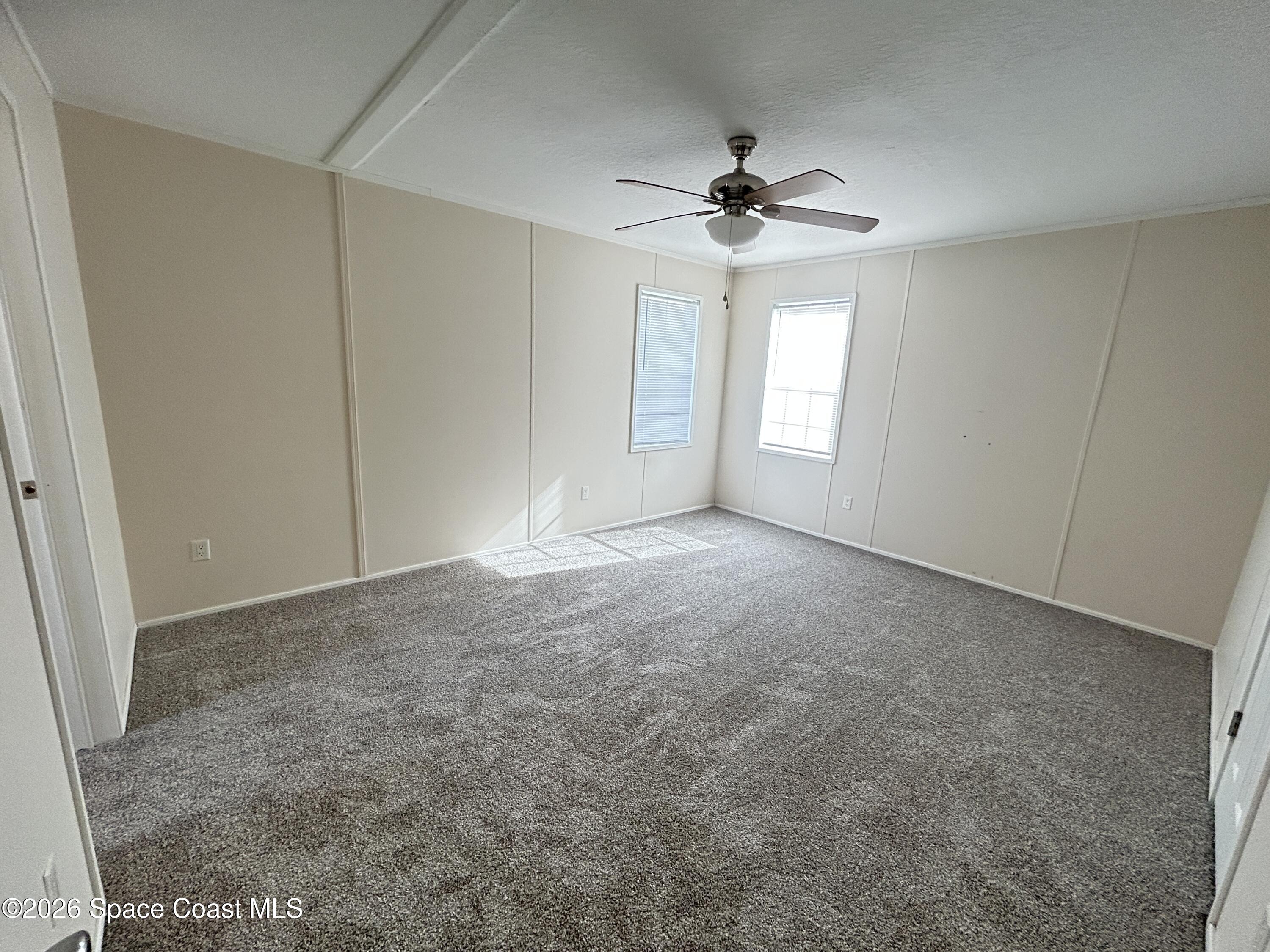 117 Lewis Street Edgewater, FL 32141 - Photo 14 of 26 a view of an empty room with a window