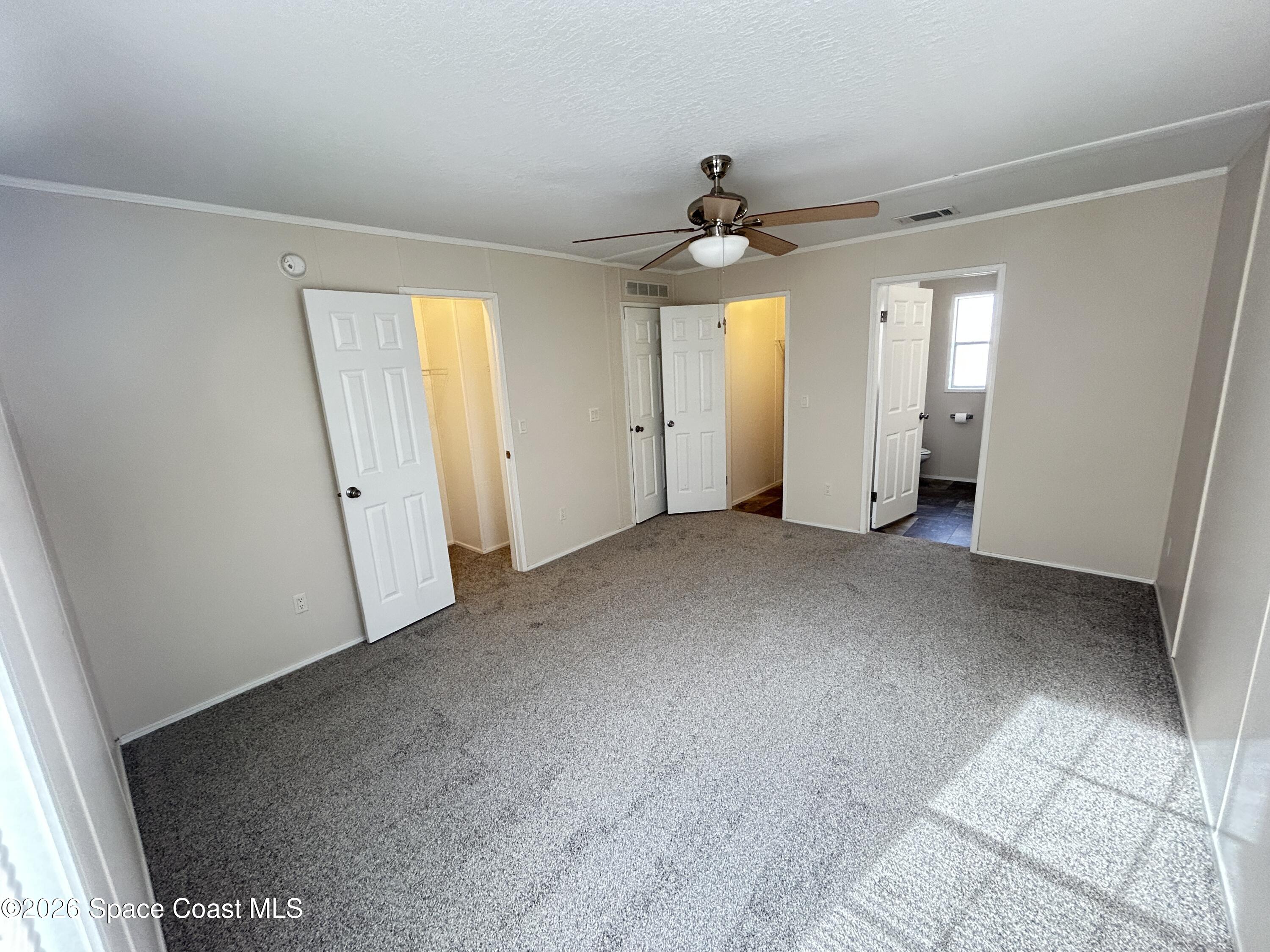 117 Lewis Street Edgewater, FL 32141 - Photo 15 of 26 wooden floor in an empty room with a window