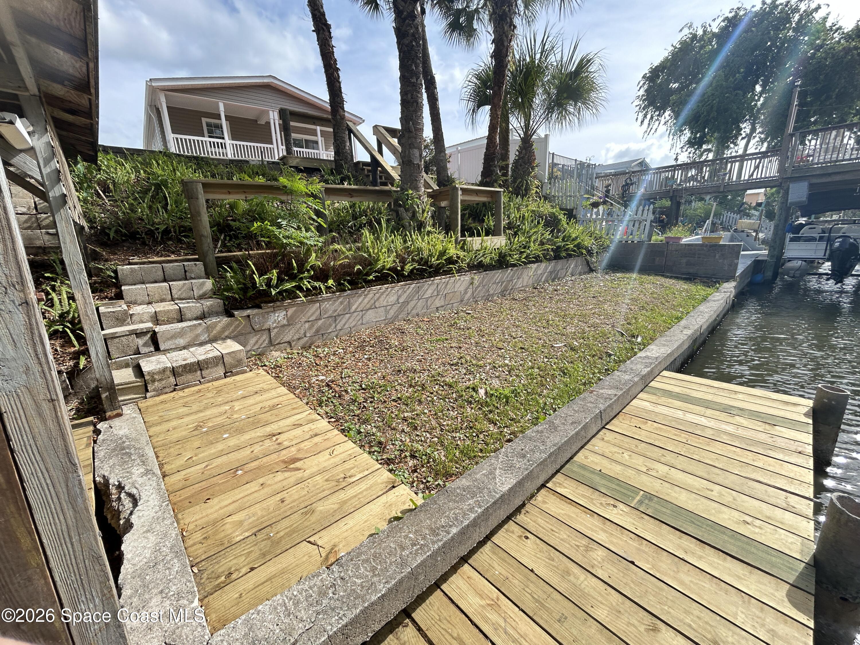 117 Lewis Street Edgewater, FL 32141 - Photo 5 of 26 a view of a backyard with plants
