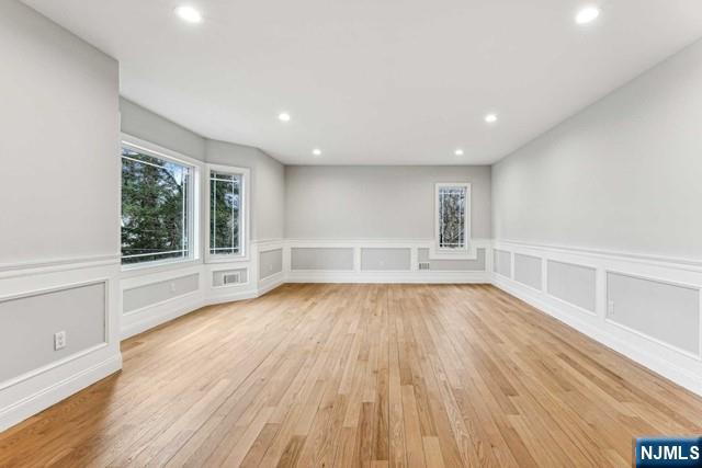 25 Jones Court Norwood, NJ 07648 - Photo 11 of 50 a view of an empty room with wooden floor and a window