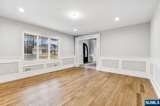 25 Jones Court Norwood, NJ 07648 - Photo 12 of 50 a view of an empty room with wooden floor and a window