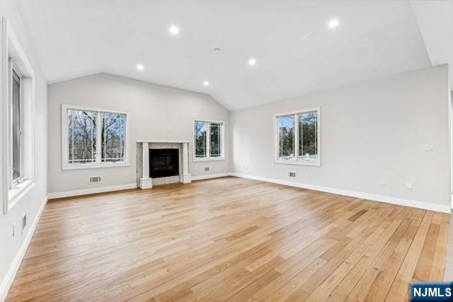 25 Jones Court Norwood, NJ 07648 - Photo 23 of 50 an empty room with wooden floor and windows