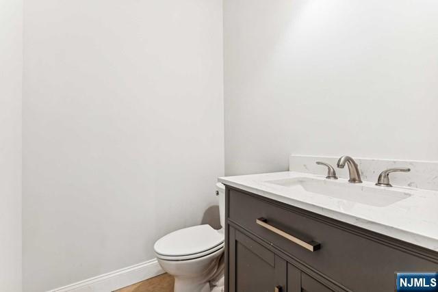 25 Jones Court Norwood, NJ 07648 - Photo 24 of 50 a bathroom with a sink and a toilet