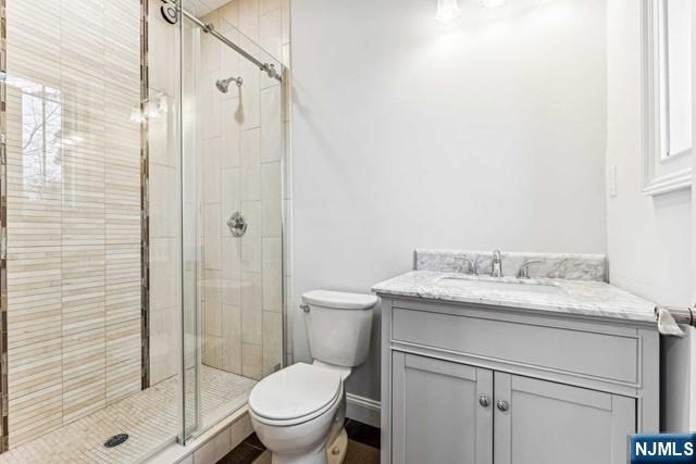 25 Jones Court Norwood, NJ 07648 - Photo 27 of 50 a bathroom with a granite countertop sink toilet and shower