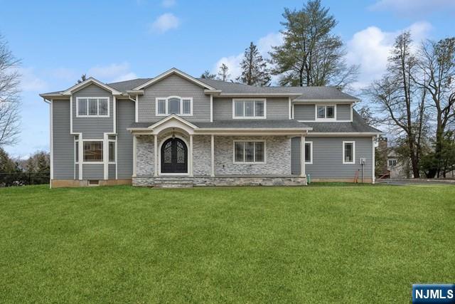 25 Jones Court Norwood, NJ 07648 - Photo 3 of 50 a front view of a house with a garden