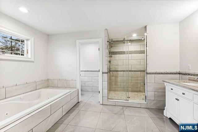 25 Jones Court Norwood, NJ 07648 - Photo 31 of 50 a bathroom with a granite countertop bathtub shower and sink