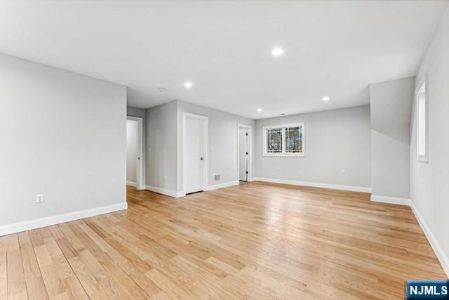 25 Jones Court Norwood, NJ 07648 - Photo 37 of 50 a view of an empty room with wooden floor and closet