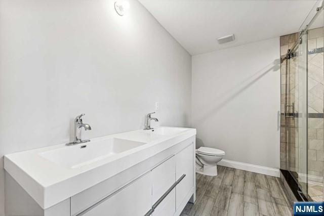 25 Jones Court Norwood, NJ 07648 - Photo 38 of 50 a bathroom with a sink toilet and shower