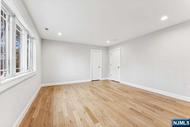 25 Jones Court Norwood, NJ 07648 - Photo 40 of 50 a view of empty room with wooden floor and fan