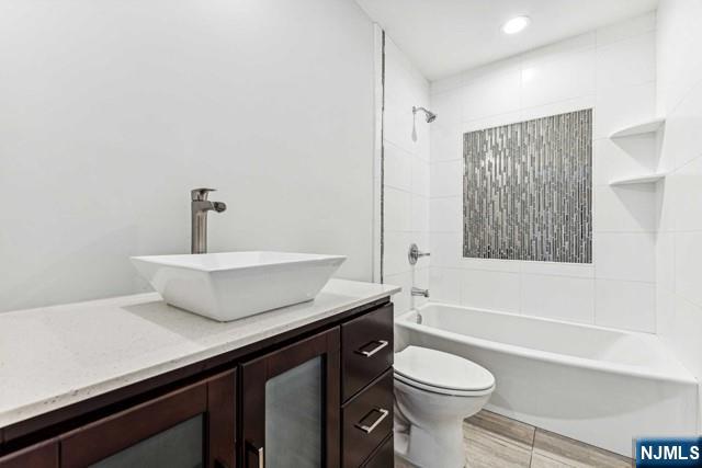 25 Jones Court Norwood, NJ 07648 - Photo 41 of 50 a bathroom with a sink a toilet and a bathtub