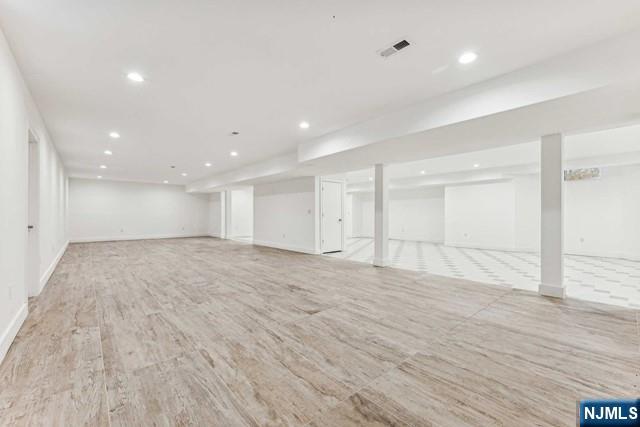 25 Jones Court Norwood, NJ 07648 - Photo 45 of 50 a view of an empty room with wooden floor