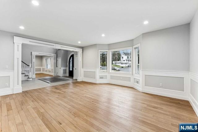 25 Jones Court Norwood, NJ 07648 - Photo 9 of 50 a view of an empty room with wooden floor and a window