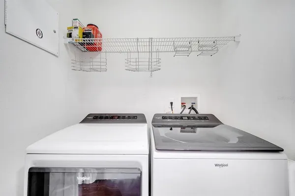 a utility room with dryer and washer