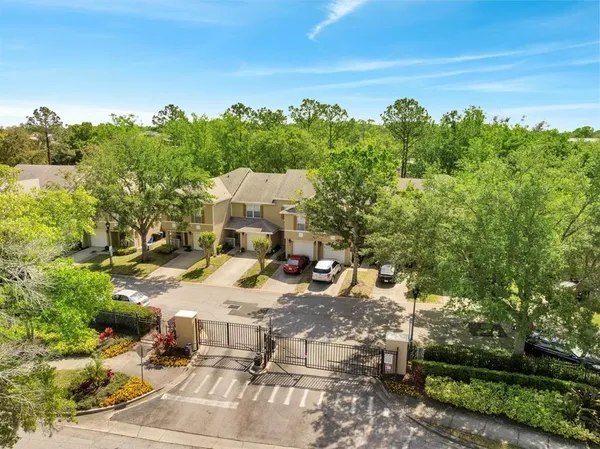 an aerial view of a house with yard swimming pool and outdoor seating