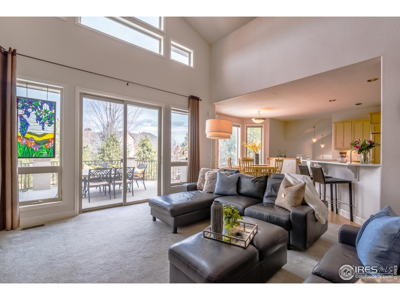 2435 Targhee Point Lafayette, CO 80026 - Photo 12 of 39 a living room with furniture and a large window