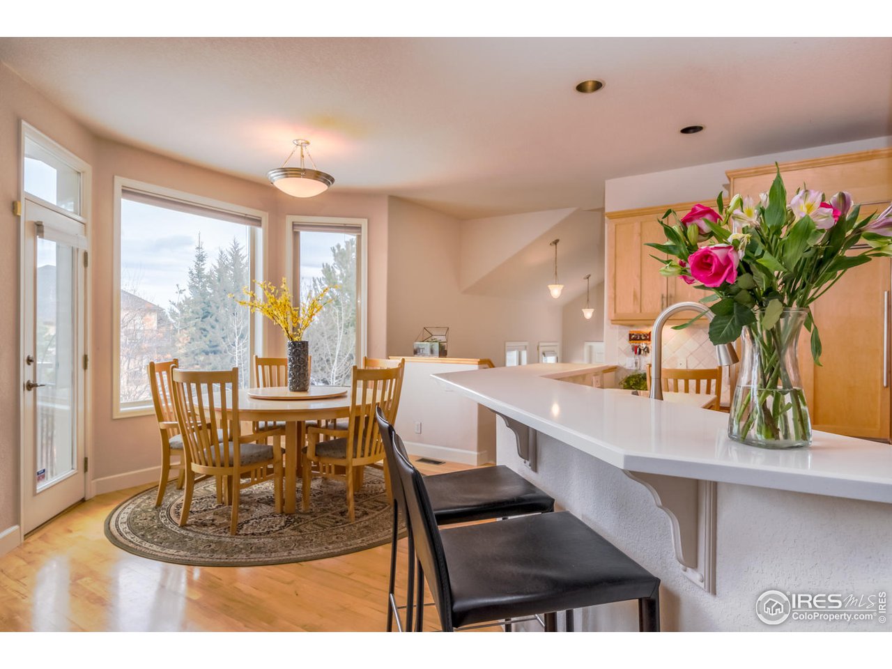2435 Targhee Point Lafayette, CO 80026 - Photo 13 of 39 a view of a dining room with furniture window and outside view
