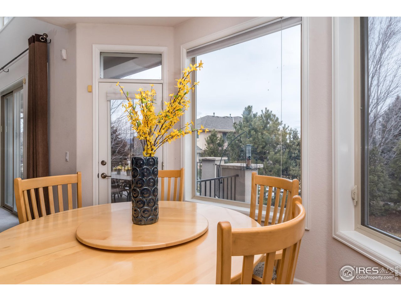 2435 Targhee Point Lafayette, CO 80026 - Photo 14 of 39 a view of a dining room with furniture window and wooden floor