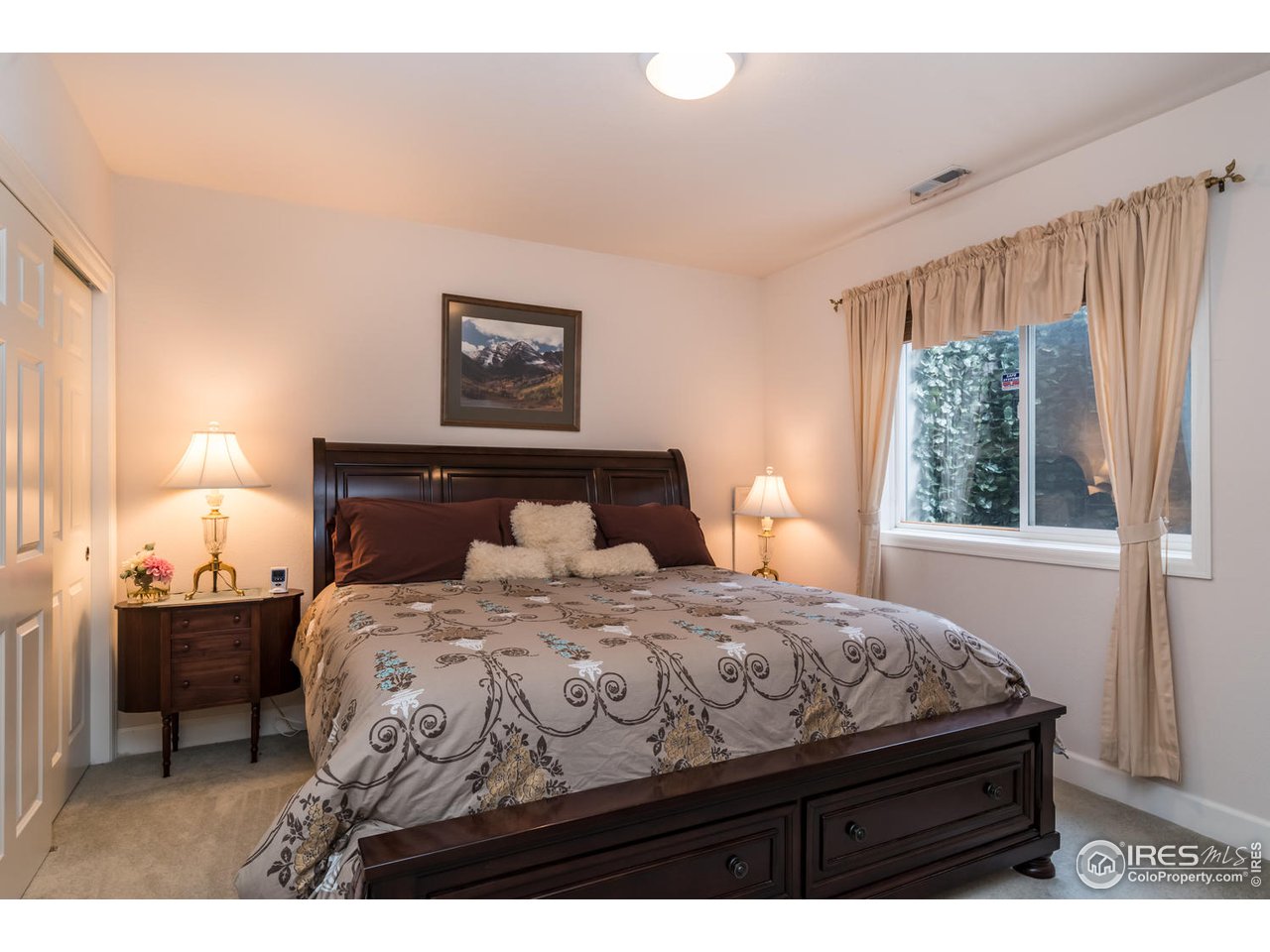 2435 Targhee Point Lafayette, CO 80026 - Photo 25 of 39 a bedroom with a bed and window