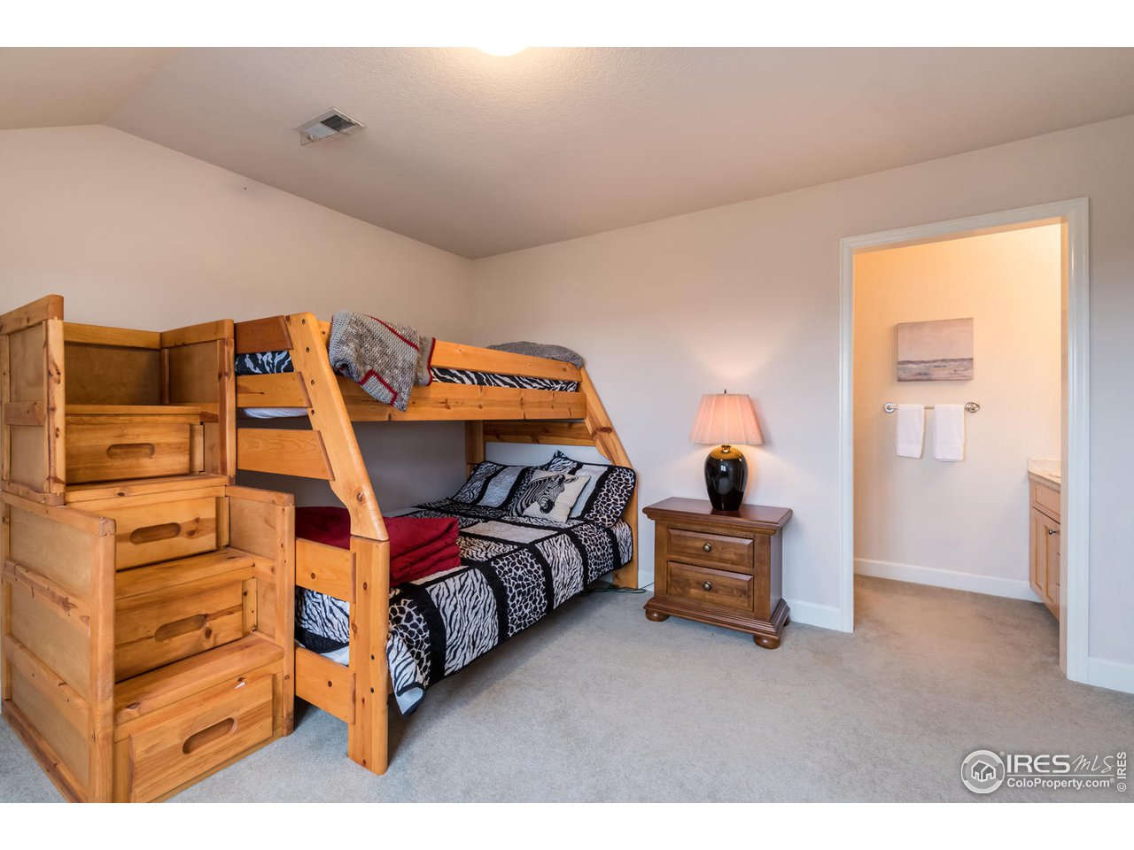 2435 Targhee Point Lafayette, CO 80026 - Photo 27 of 39 a bedroom with a bed and with furniture