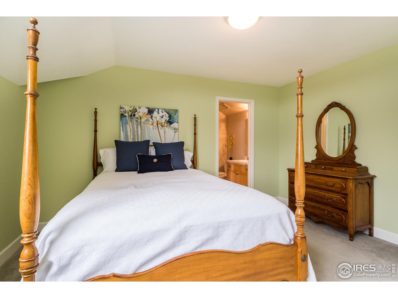 2435 Targhee Point Lafayette, CO 80026 - Photo 28 of 39 a bedroom with a bed and a dresser