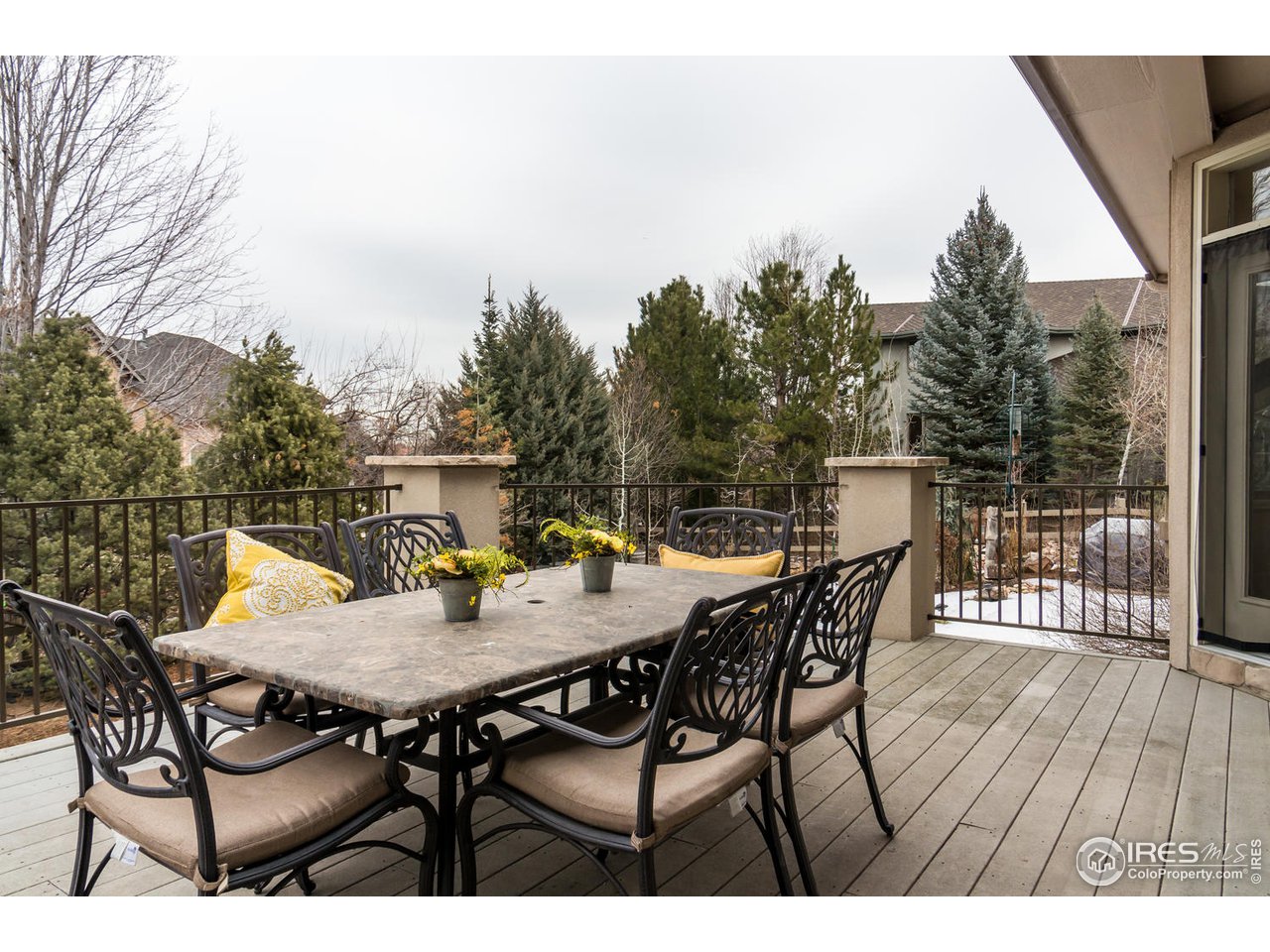 2435 Targhee Point Lafayette, CO 80026 - Photo 30 of 39 a view of a roof deck with table and chairs