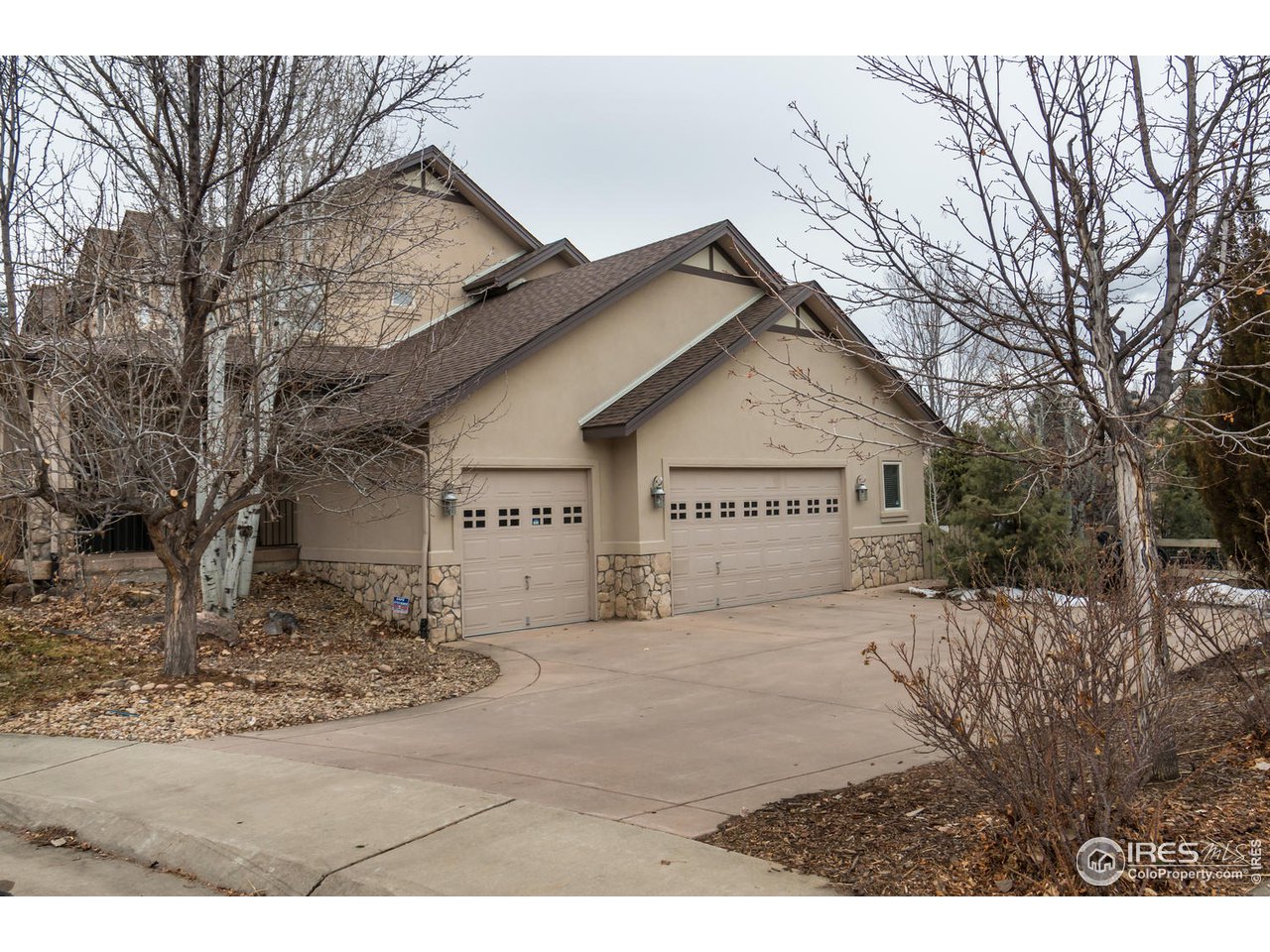 2435 Targhee Point Lafayette, CO 80026 - Photo 32 of 39 a view of a house with a yard covered in snow
