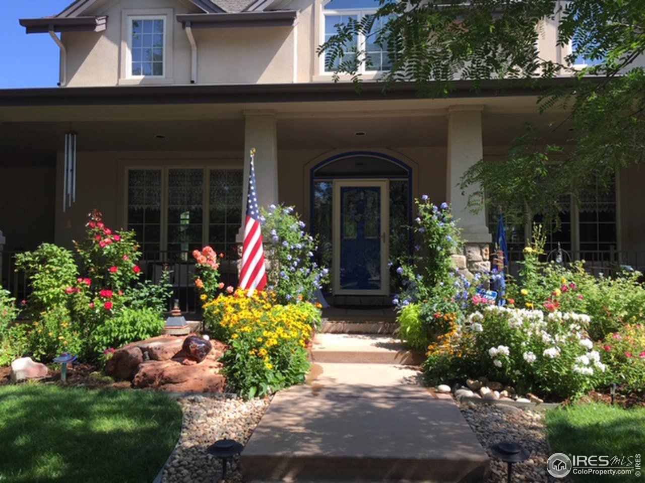 2435 Targhee Point Lafayette, CO 80026 - Photo 34 of 39 front view of a house with a yard