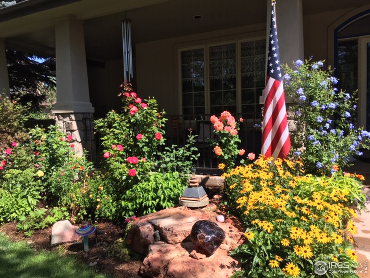 2435 Targhee Point Lafayette, CO 80026 - Photo 37 of 39 a front view of a house with a flower plant
