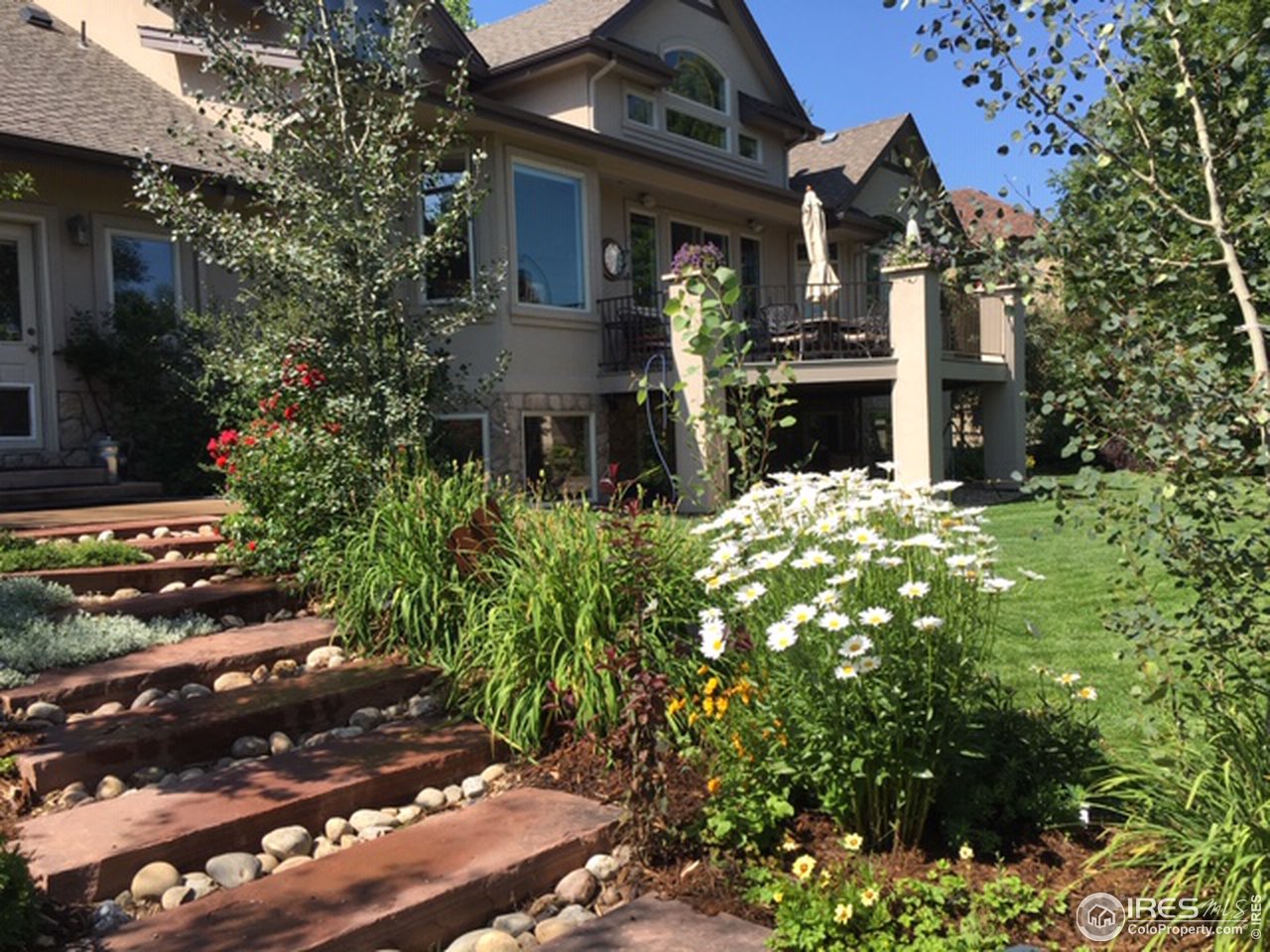 2435 Targhee Point Lafayette, CO 80026 - Photo 38 of 39 a front view of a house with a yard