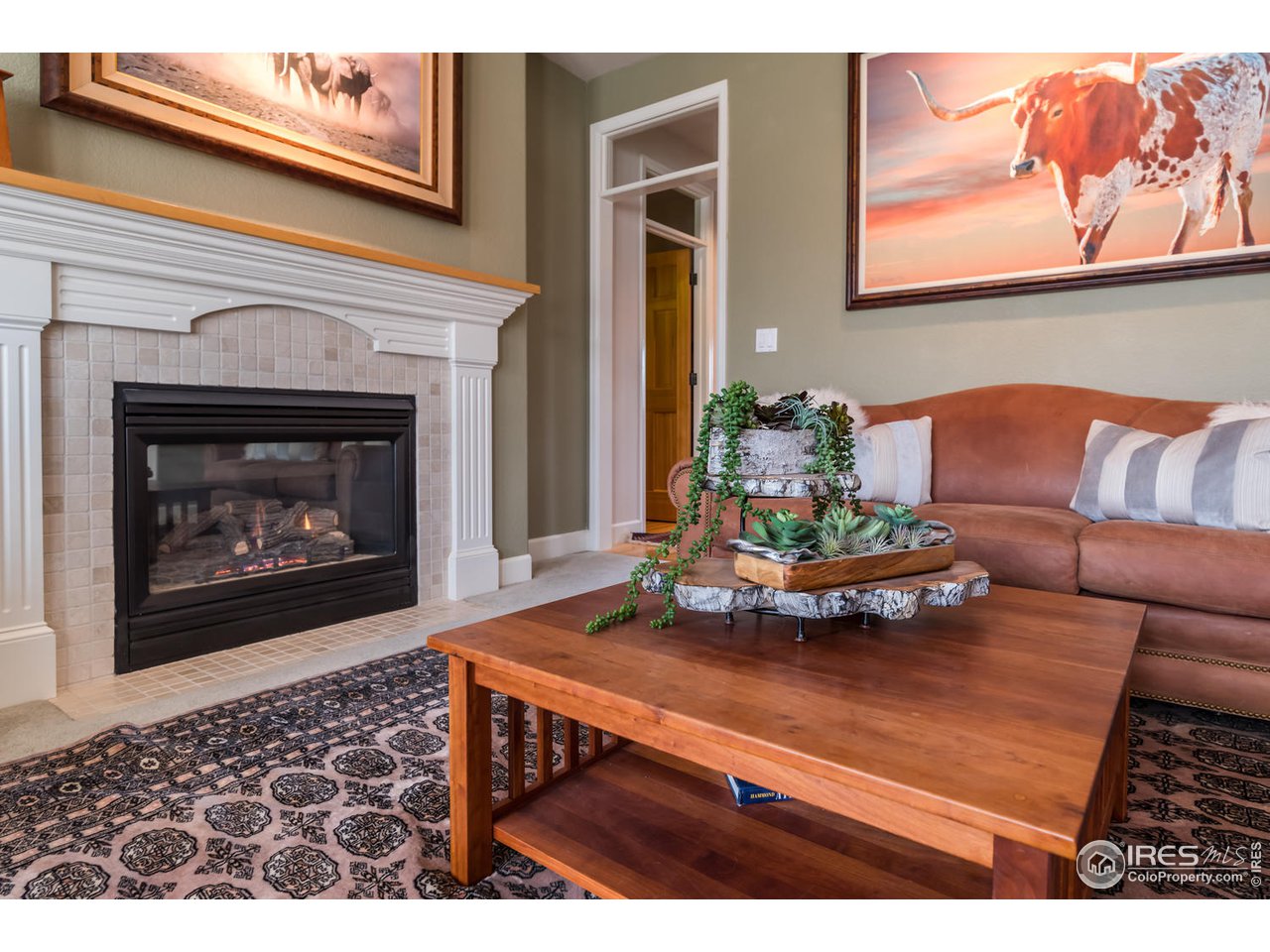 2435 Targhee Point Lafayette, CO 80026 - Photo 7 of 39 a living room with furniture and a fireplace