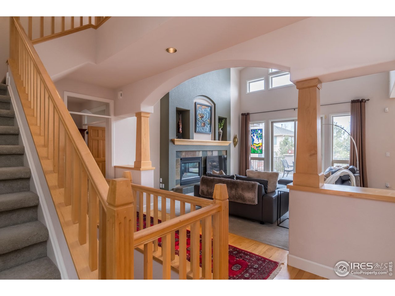 2435 Targhee Point Lafayette, CO 80026 - Photo 9 of 39 a living room with furniture and a fireplace