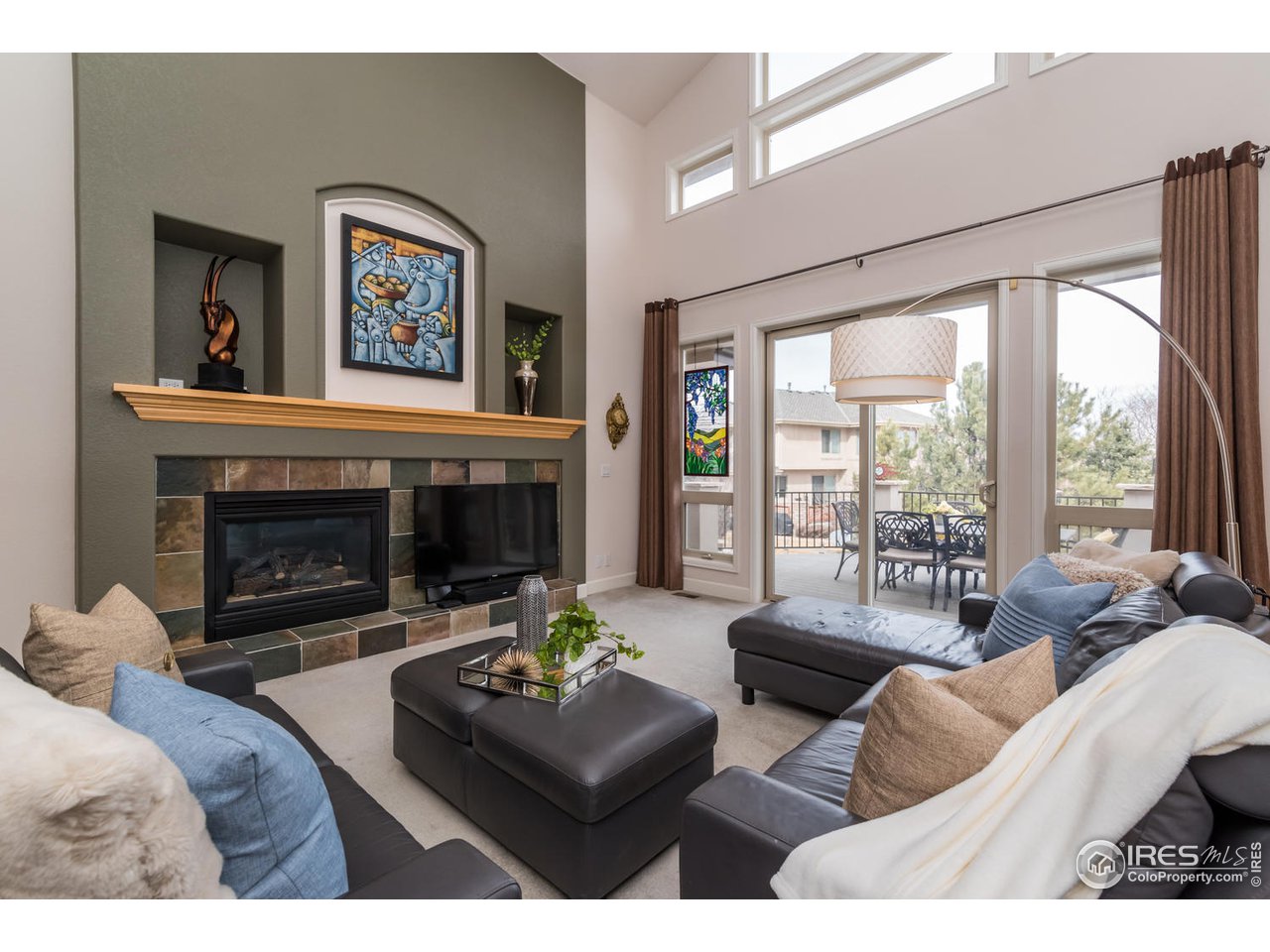 2435 Targhee Point Lafayette, CO 80026 - Photo 10 of 39 a living room with furniture and a fireplace